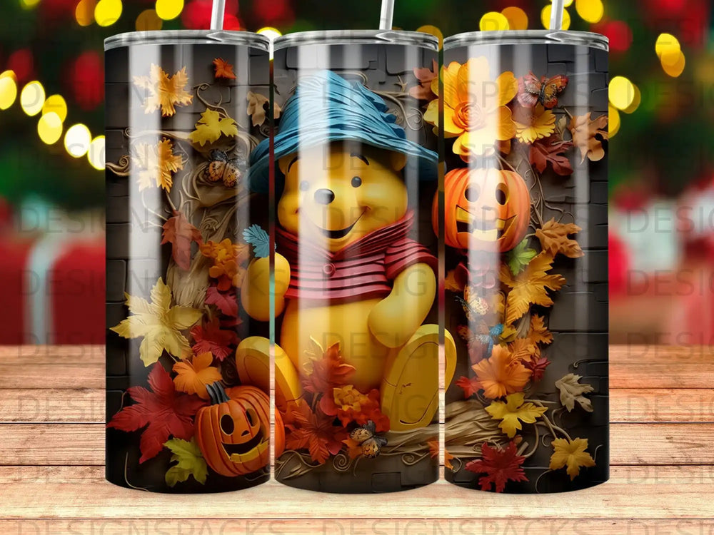 Winnie the Pooh with pumpkins and fall leaves on a tumbler.