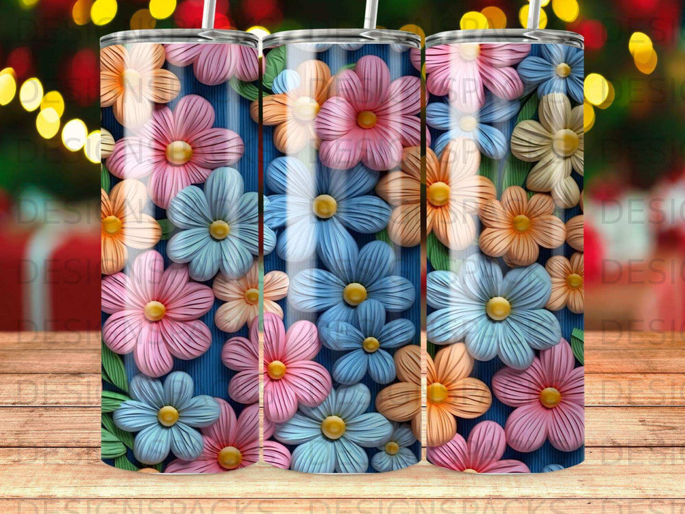 Floral tumbler with blue striped background and colorful flowers.