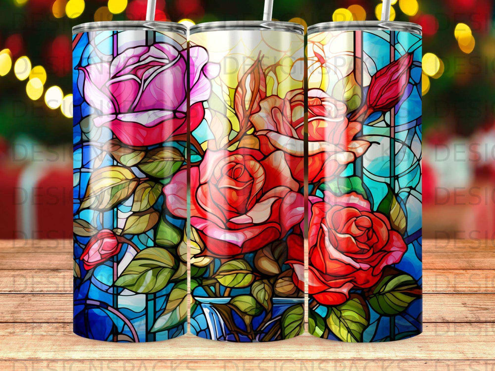 Stained glass tumbler with red and pink roses and green leaves.