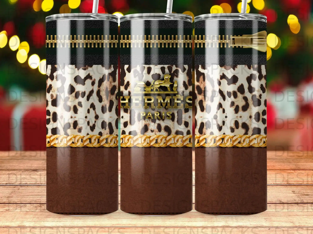 Hermes Paris logo on leopard print tumbler with gold zipper detail.