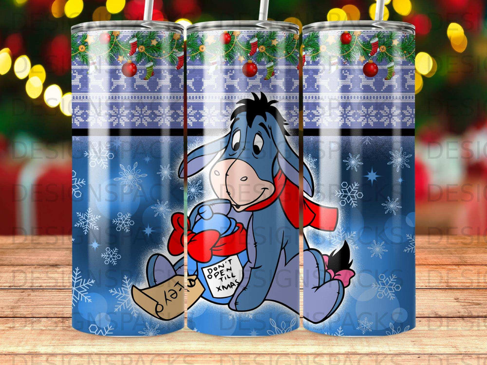 Eeyore with a present and "Don't Open Till Xmas" text on a blue patterned background.