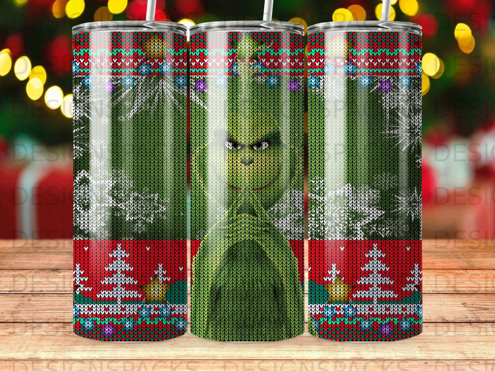 The Grinch in a knitted sweater pattern on a tumbler.