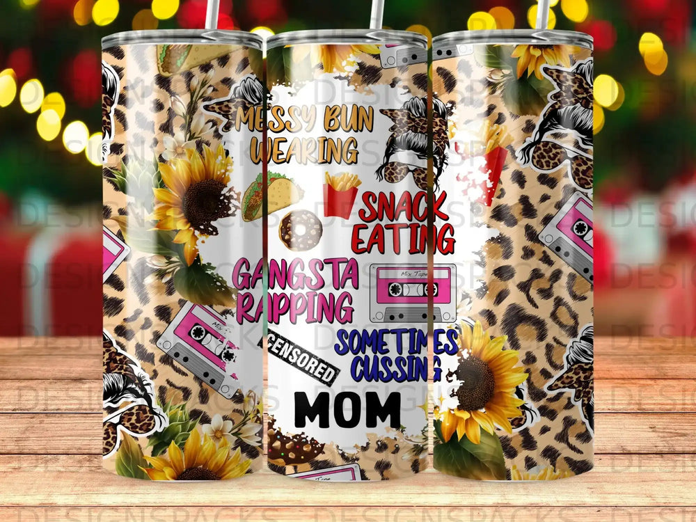 Leopard print tumbler with sunflowers, cassette tapes, and text "Messy Bun, Wearing Snacks, Gangsta Rapping, Sometimes Cussing Mom".