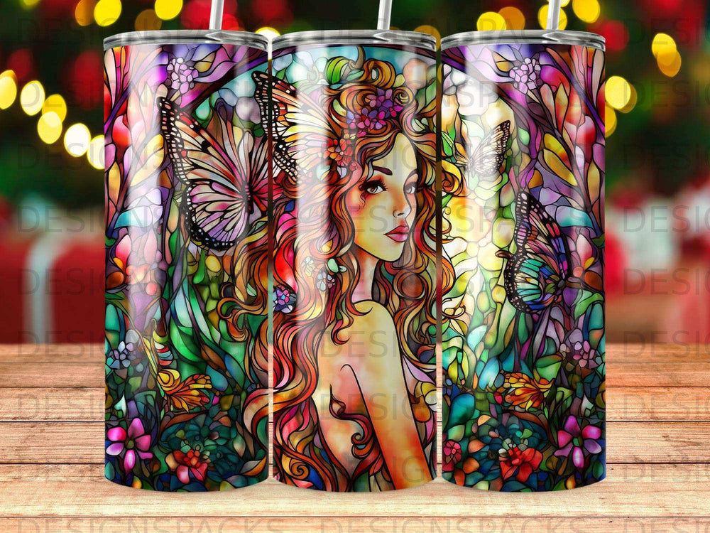 Stained glass tumbler with a woman and butterflies surrounded by flowers.
