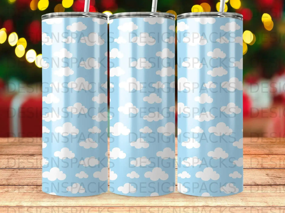 Blue tumbler with white clouds pattern.