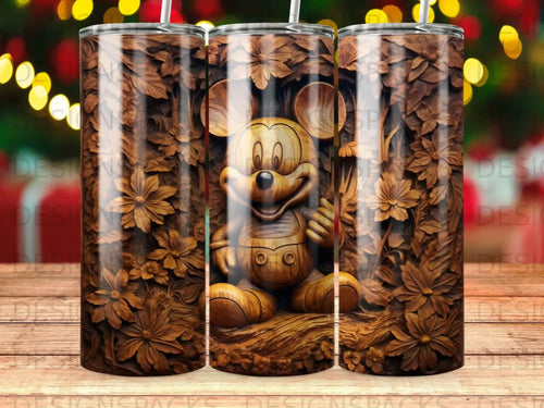 Mickey Mouse carved from wood, surrounded by floral carvings, on a tumbler.