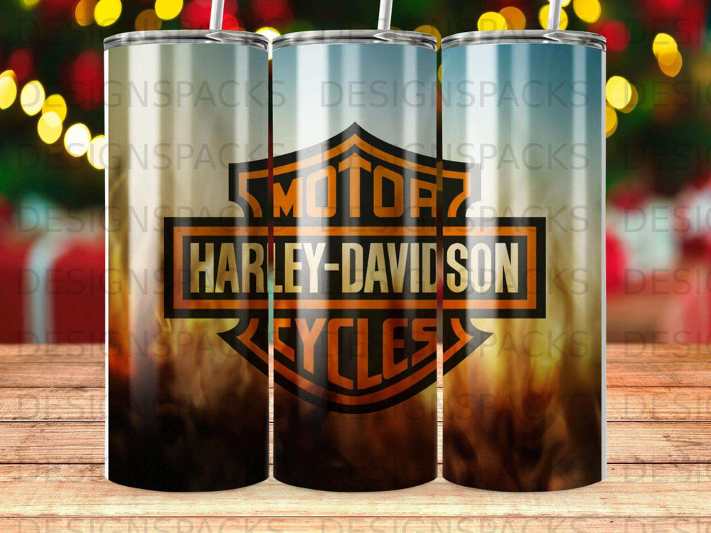 Harley-Davidson logo on a patterned tumbler with blurred background lights.