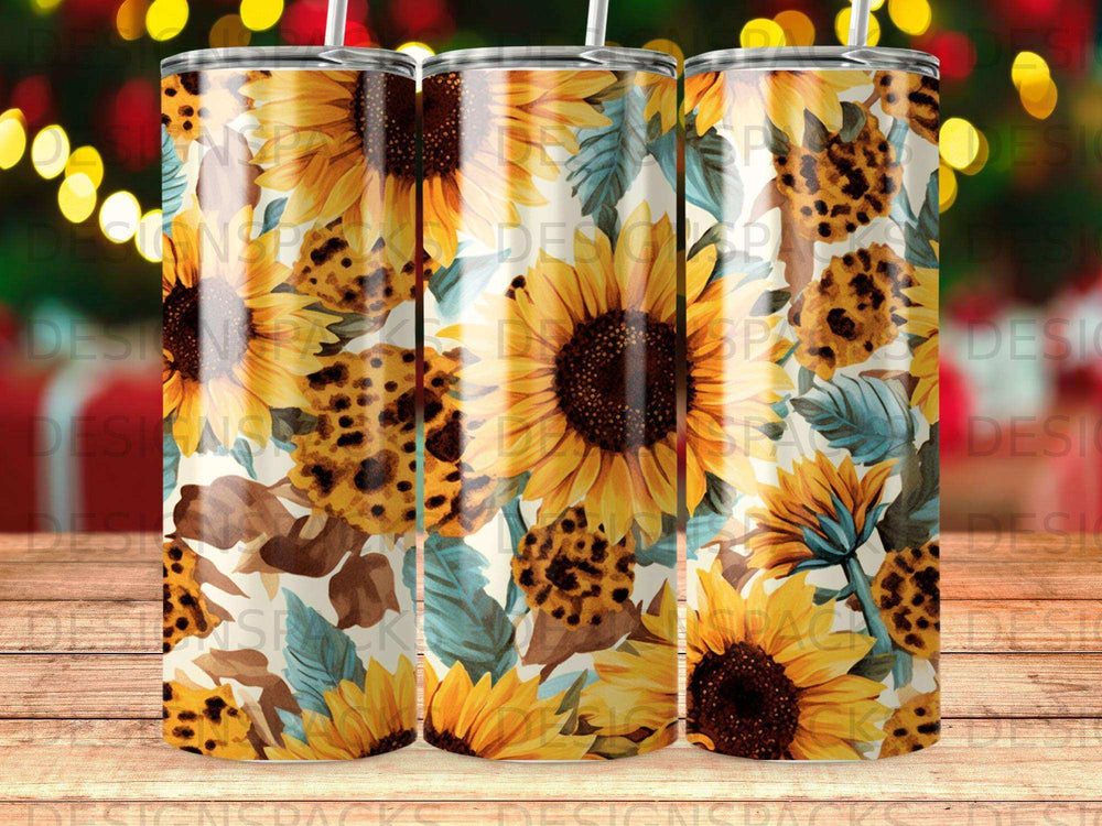Three tumblers with sunflower and leopard print designs.