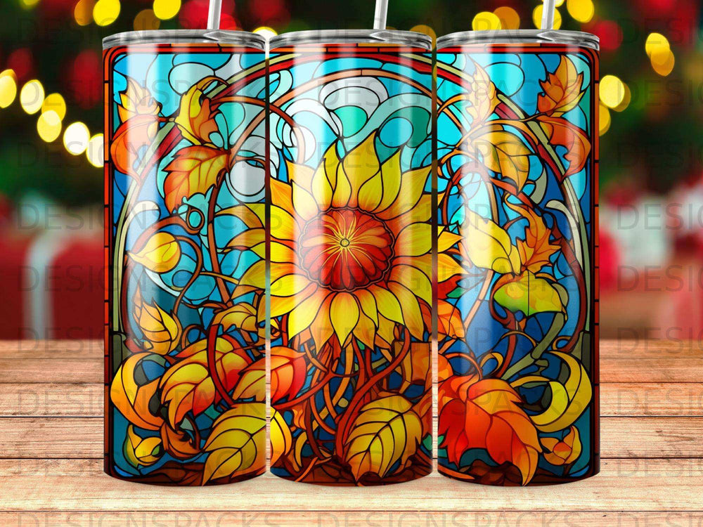 Stained glass sunflower and autumn leaves design on a tumbler.