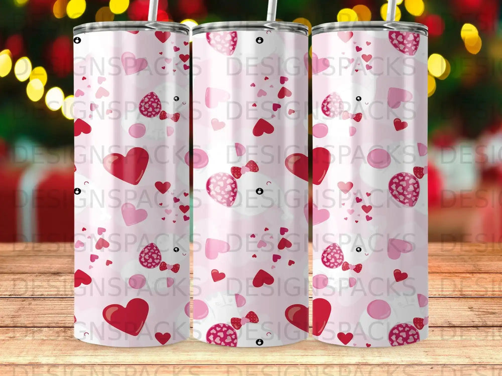 Pink tumbler with white sheep, hearts, and candy cane pattern.