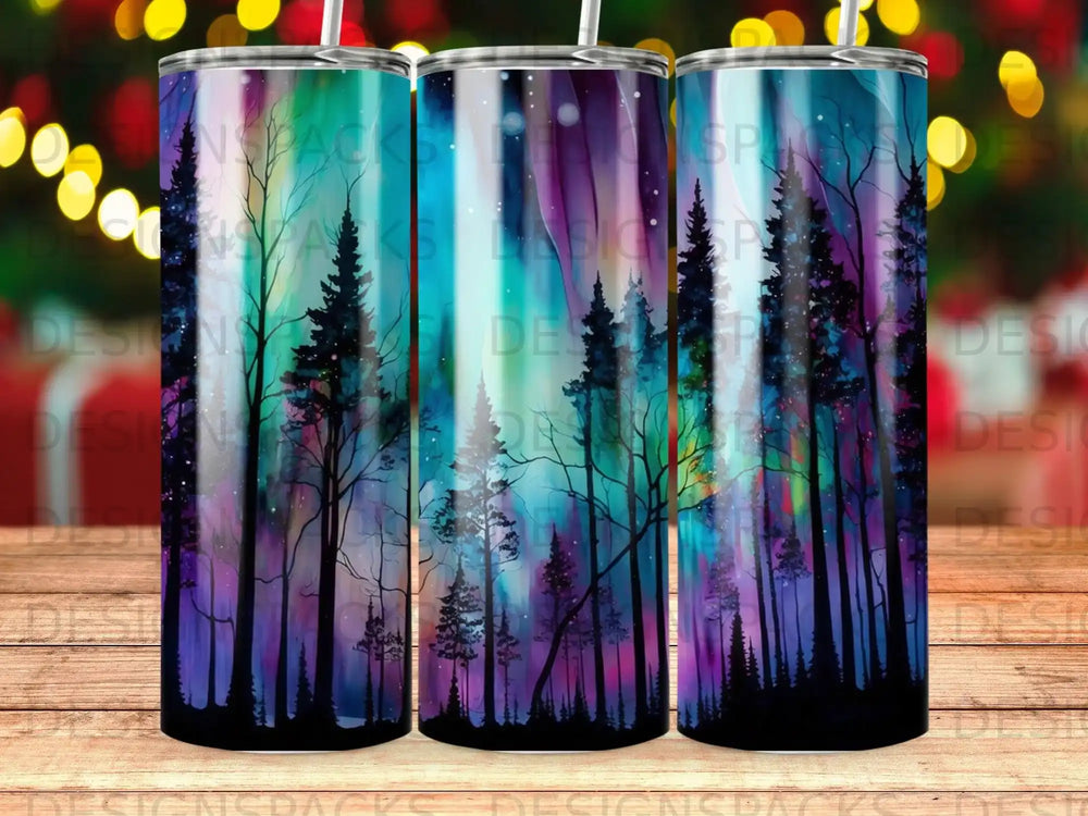 Tumbler with aurora borealis and silhouette trees design.