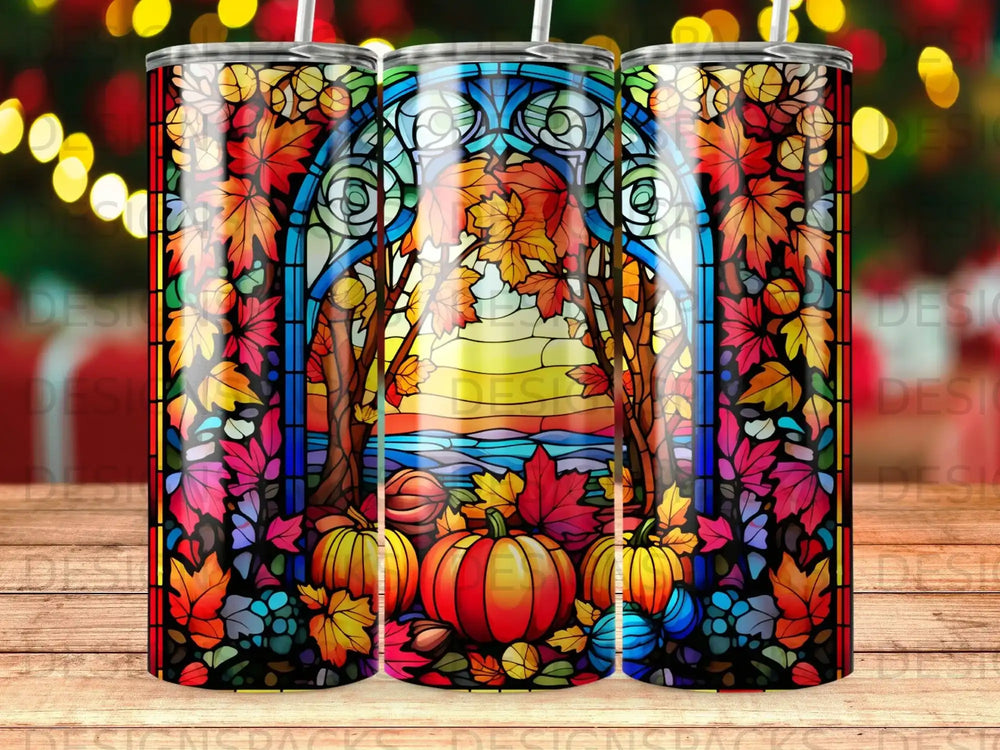Stained glass tumbler with pumpkins and autumn leaves.
