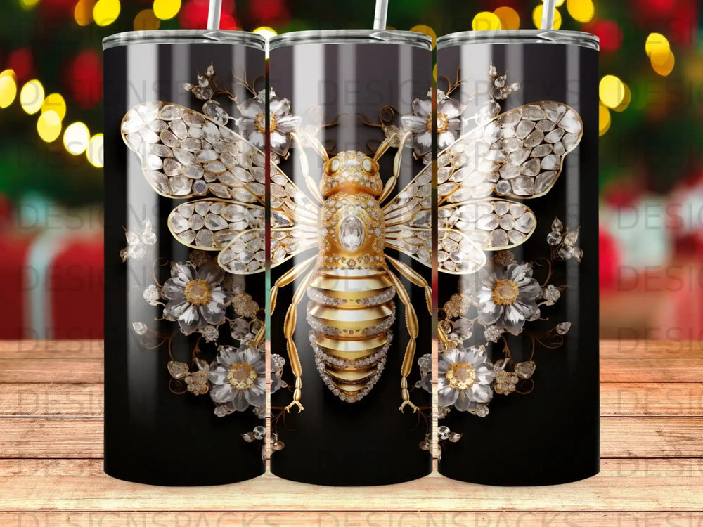 Bee with diamond wings and gold stripes on black tumbler with floral accents.