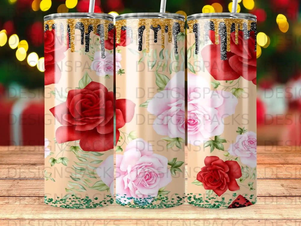 Tapered tumbler with dripping gold and red roses, surrounded by bokeh lights.