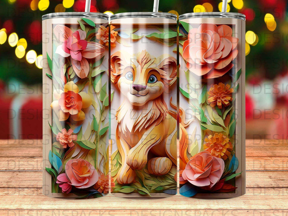 Lion cub artwork on three tumblers surrounded by paper flowers.