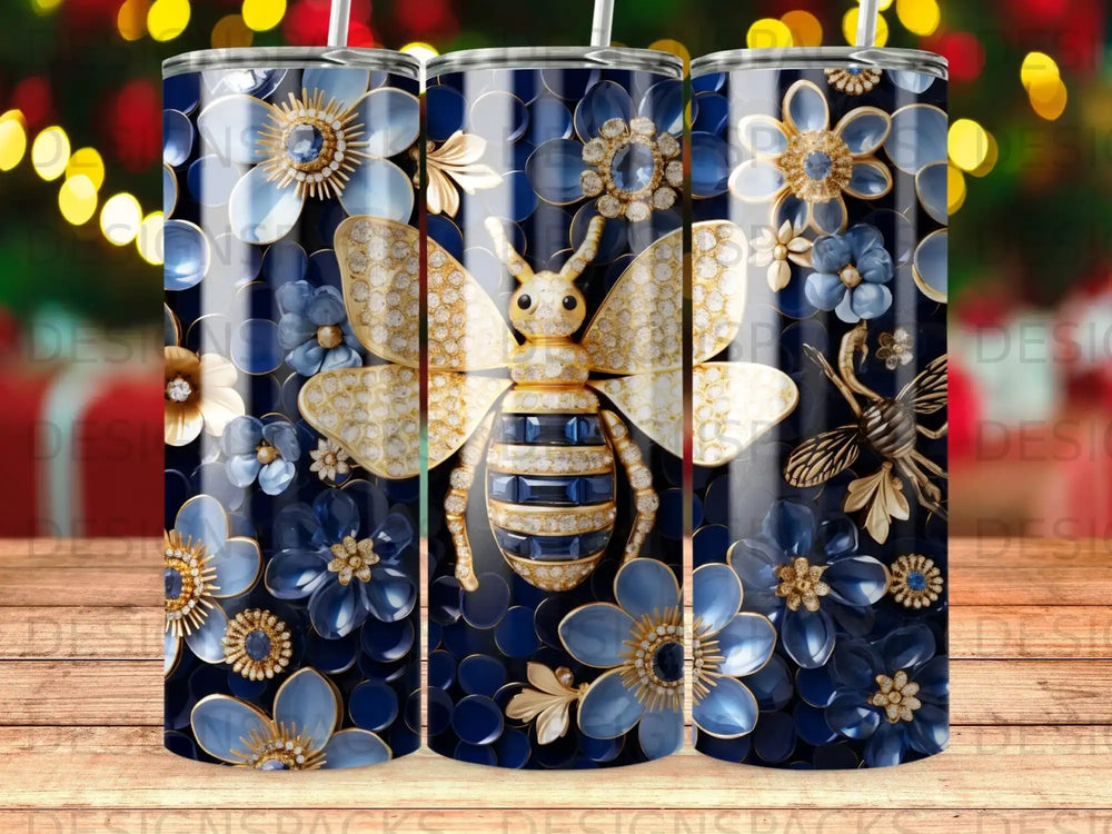Blue and gold floral and bee tumbler with striped body and jeweled wings.
