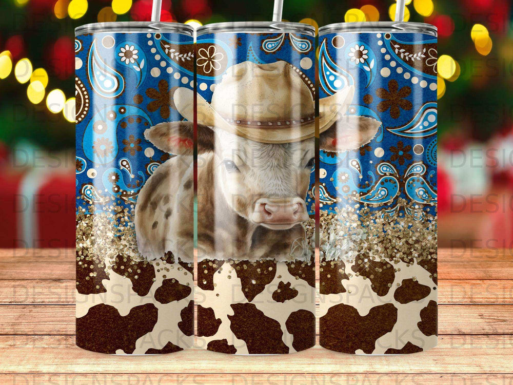 Cow wearing a cowboy hat with paisley and glitter accents.