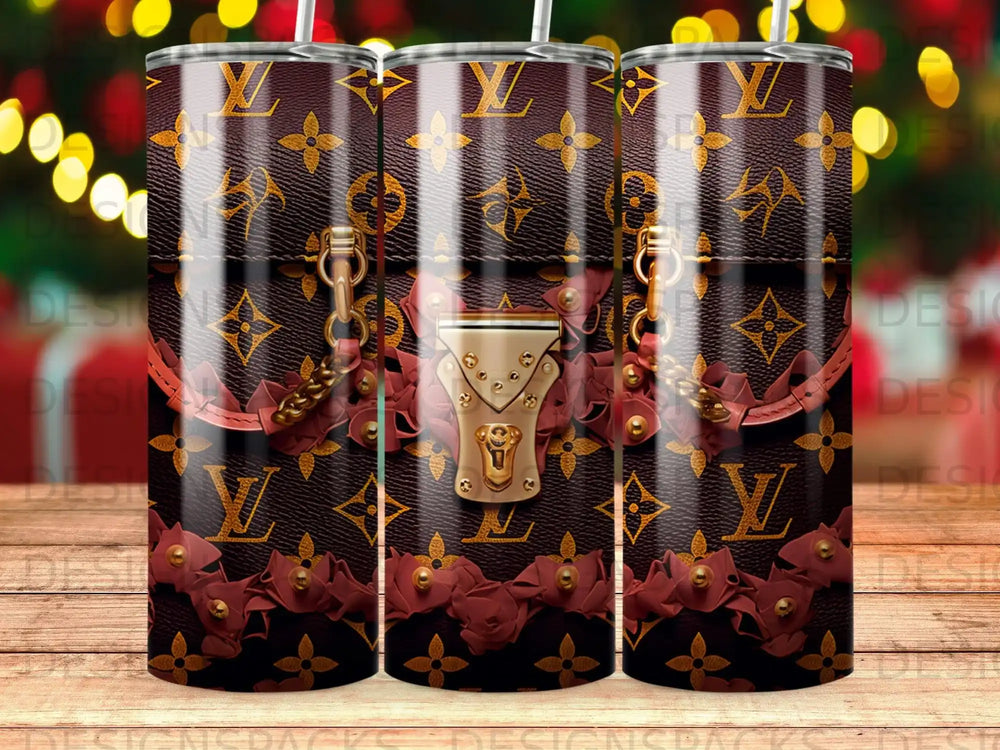 Dark brown tumbler with repeating Louis Vuitton monogram and floral embellishments.