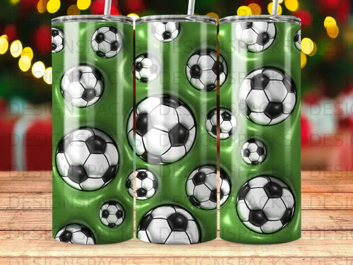 Soccer balls pattern on green striped tumbler with straw.