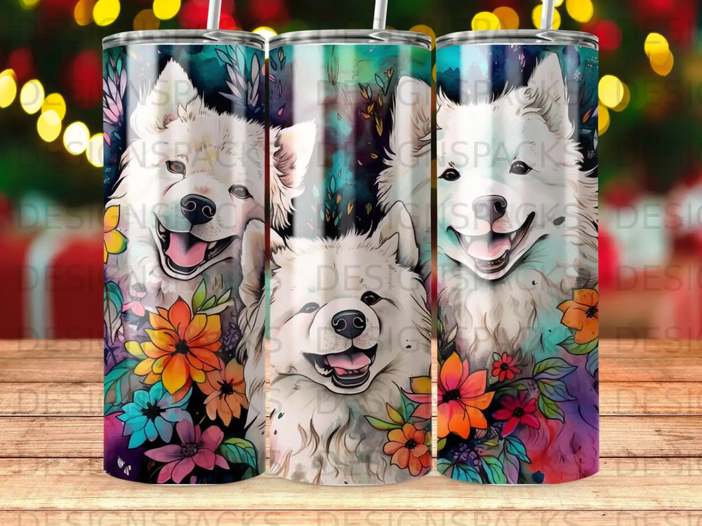 Three smiling Samoyeds with colorful floral accents on a tumbler.