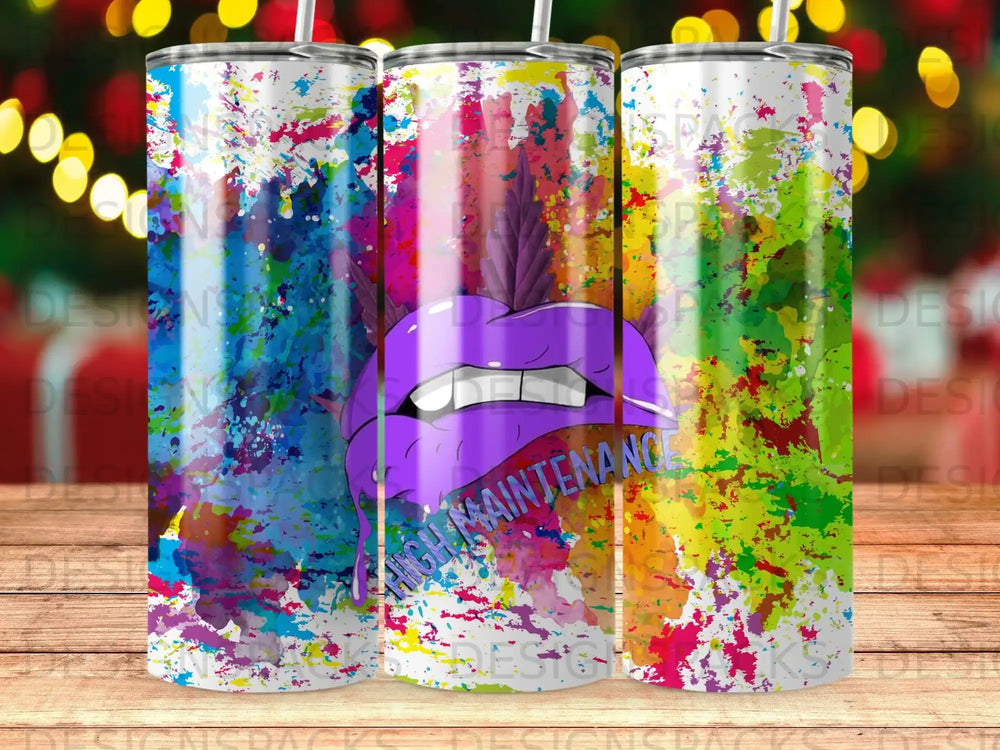 Purple lips with the text "High Maintenance" on a colorful paint splatter tumbler.