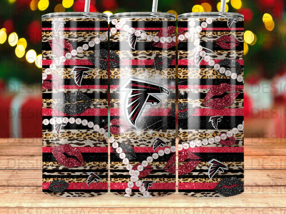 Atlanta Falcons logo on leopard print tumbler with glitter lips and pearls.