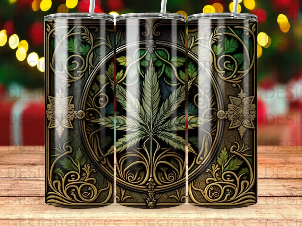 Green cannabis leaf design on a patterned tumbler with blurred festive lights.