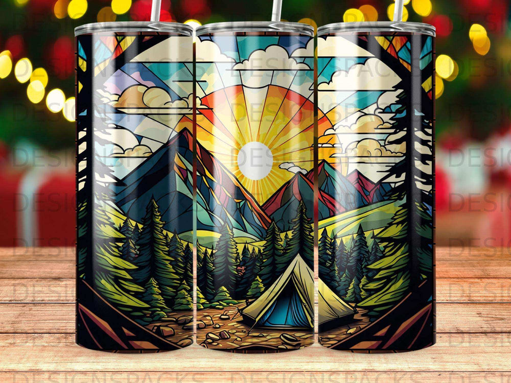 Tent in mountains with stained glass sun and trees pattern.
