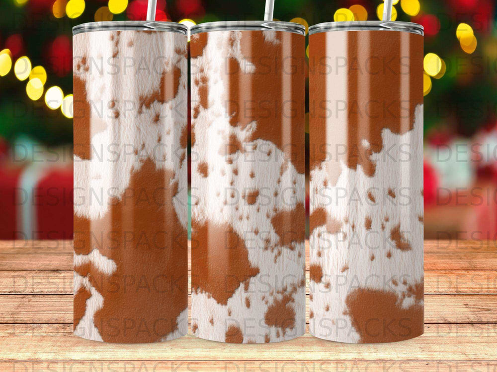 Brown and white cowhide pattern on three tumblers.