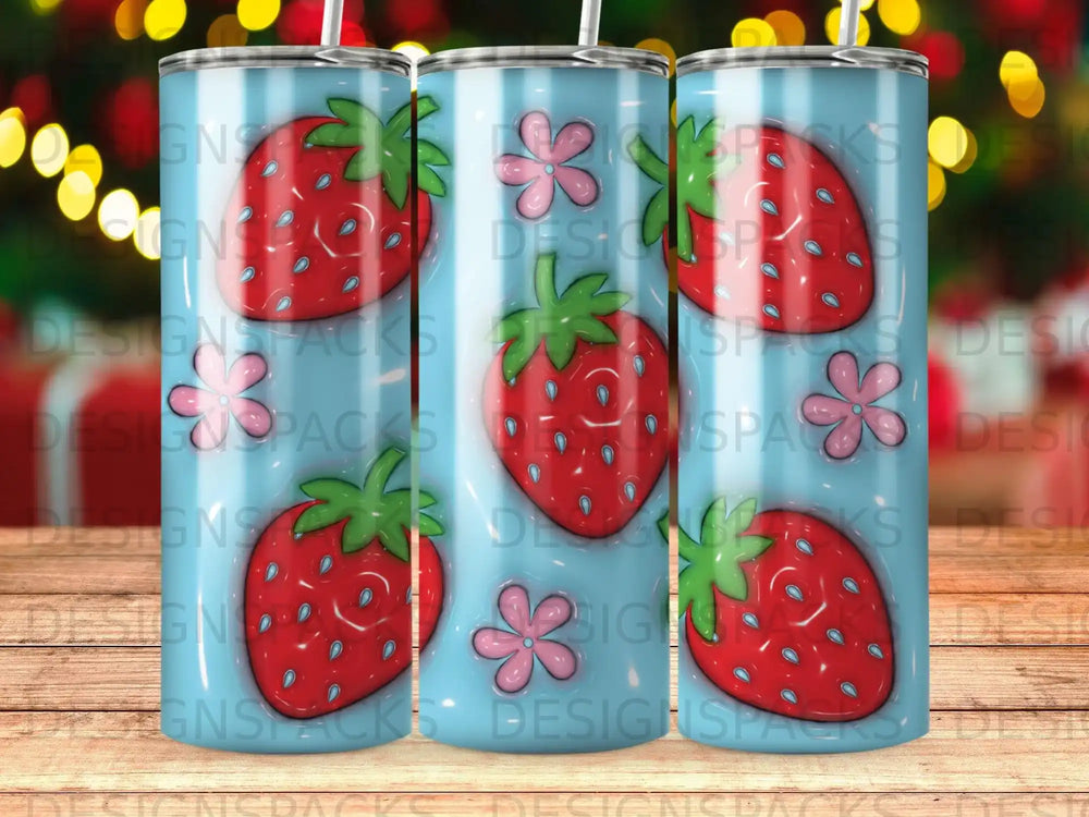 Blue tumbler with scattered strawberries and pink flowers design.