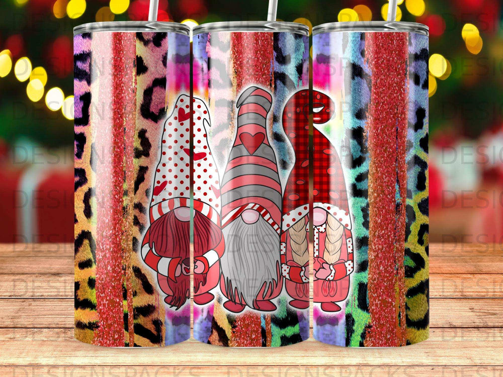 Three Valentine's Day gnomes with hearts and stripes on leopard print tumblers.
