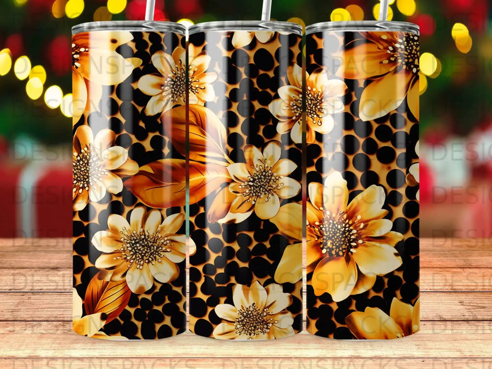 Three tumblers with a gold floral and honeycomb pattern.