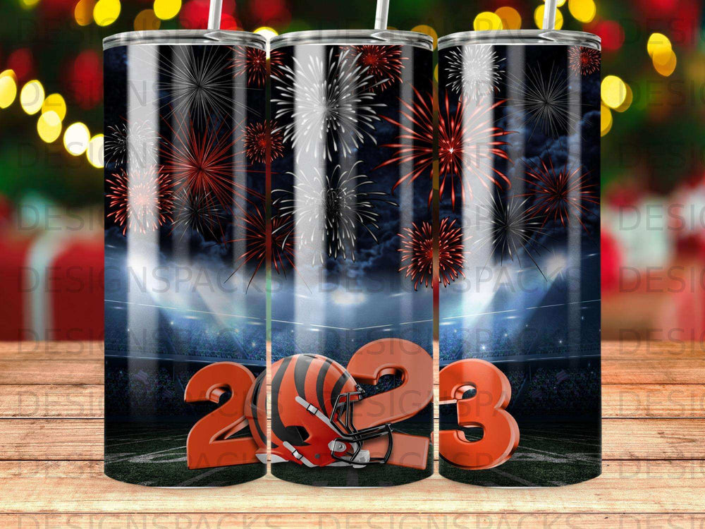 New Year's Eve fireworks behind stadium with football helmet and 2023.
