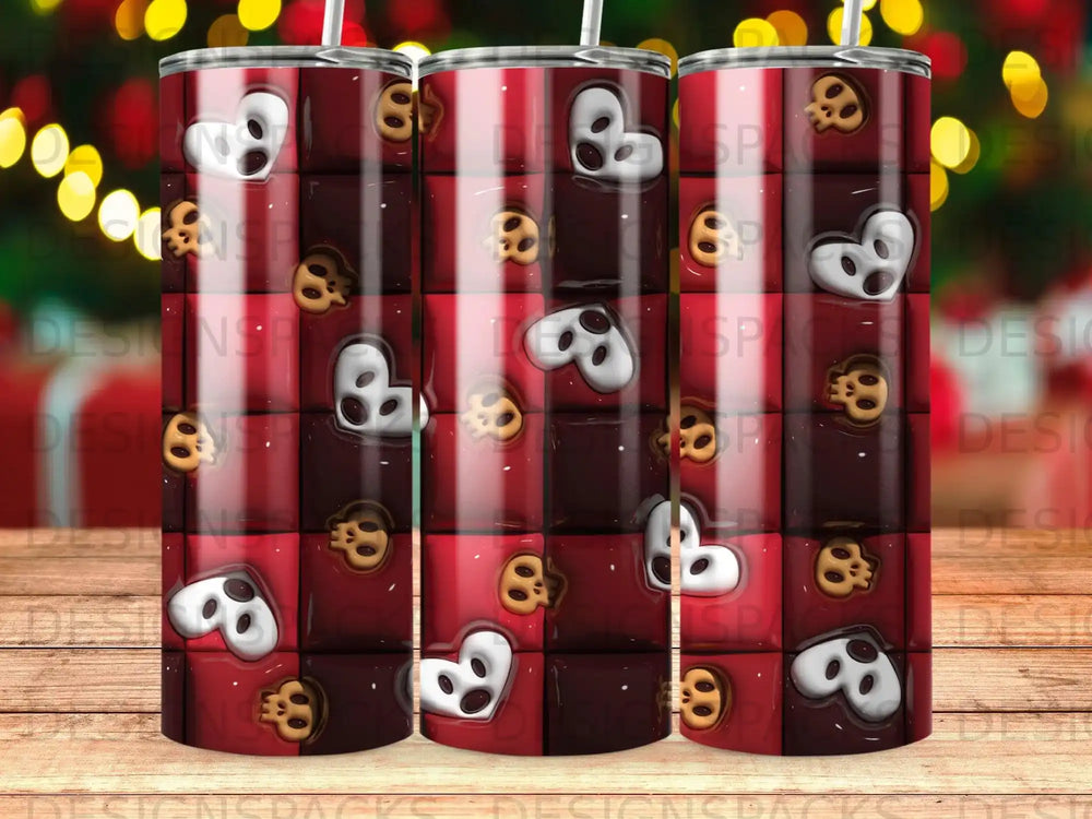 Tumbler with repeating pattern of red squares and cartoon skulls.