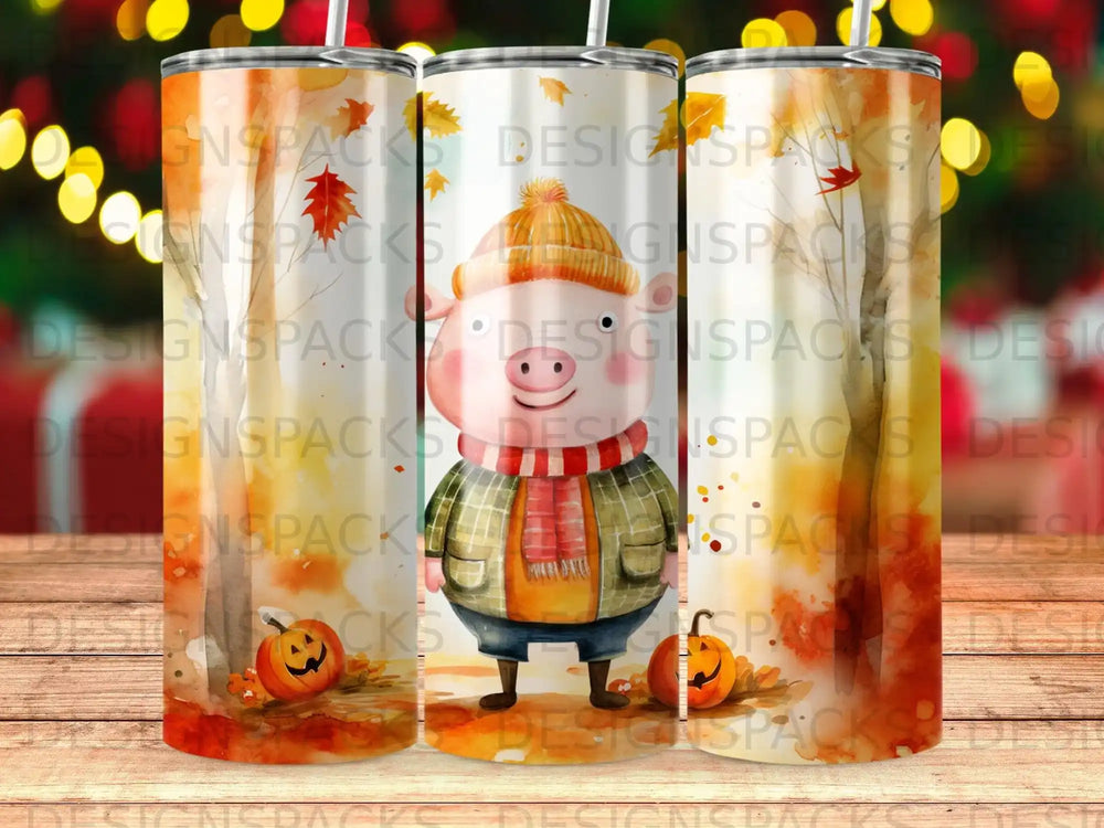 Three tumblers with a cartoon pig, pumpkins, and fall leaves design.