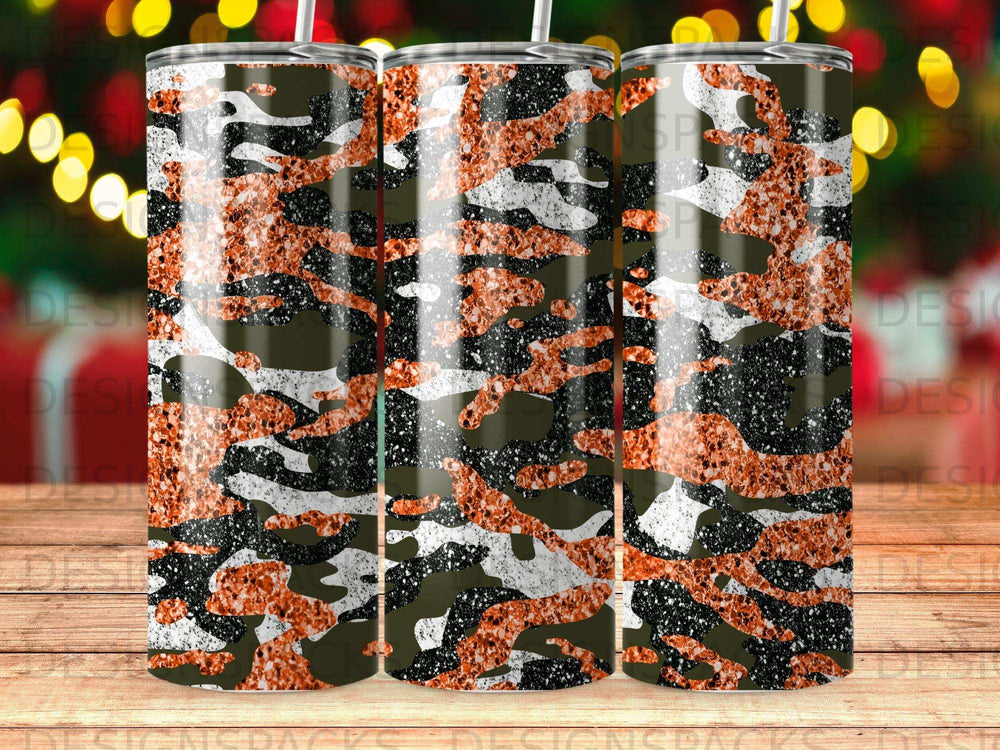 Camouflage tumbler with orange glitter accents and black speckles.