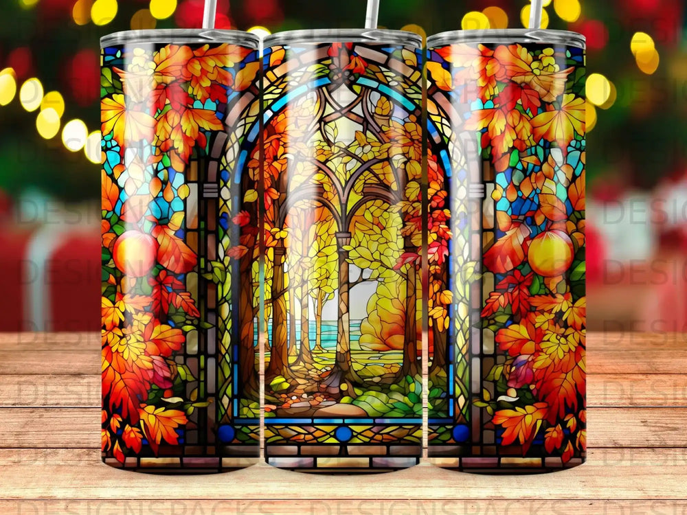 Stained glass tumbler with autumnal forest scene and stained glass archway.