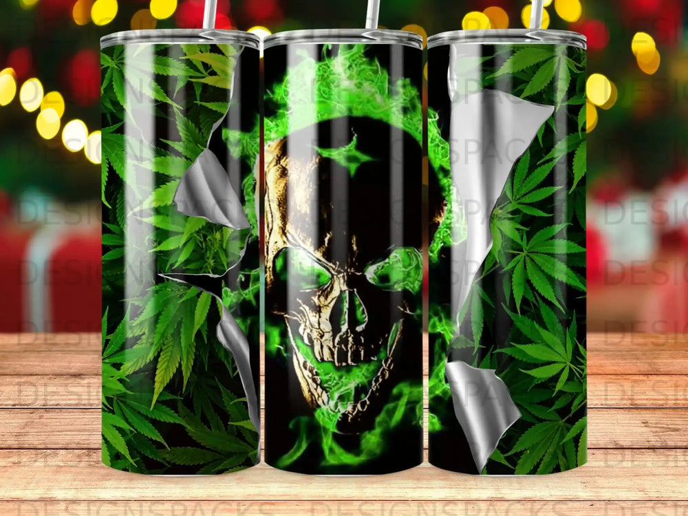 Green skull with flames and cannabis leaves on a patterned tumbler.