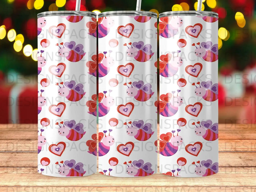 Three tumblers with a bee and heart pattern.