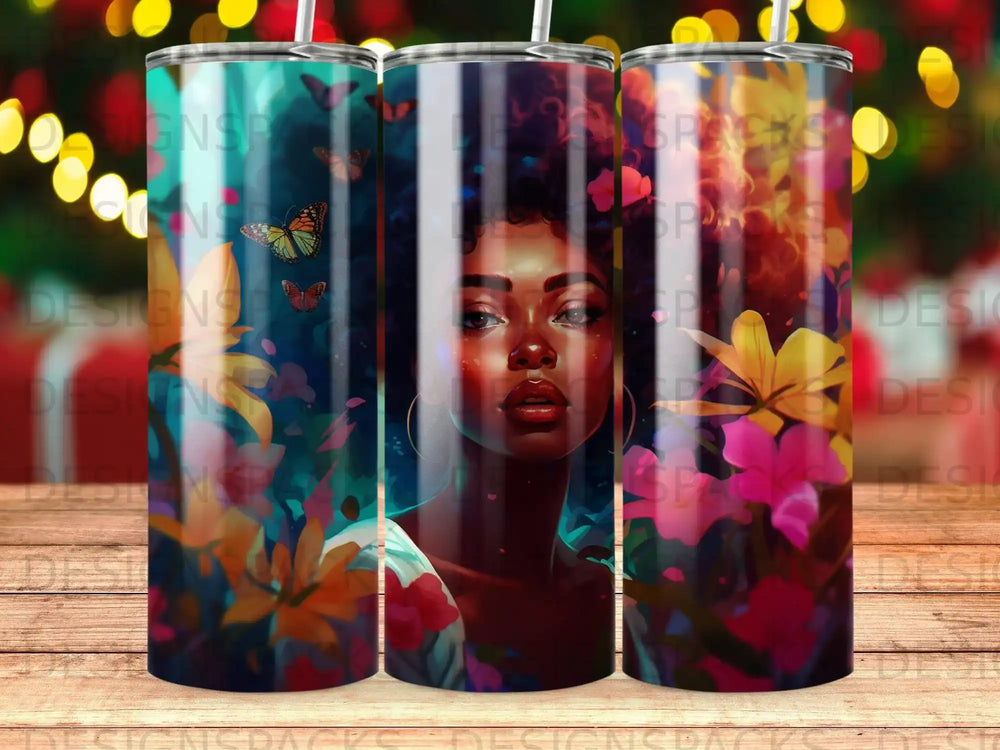 Tumbler with portrait of a woman with butterflies and flowers.
