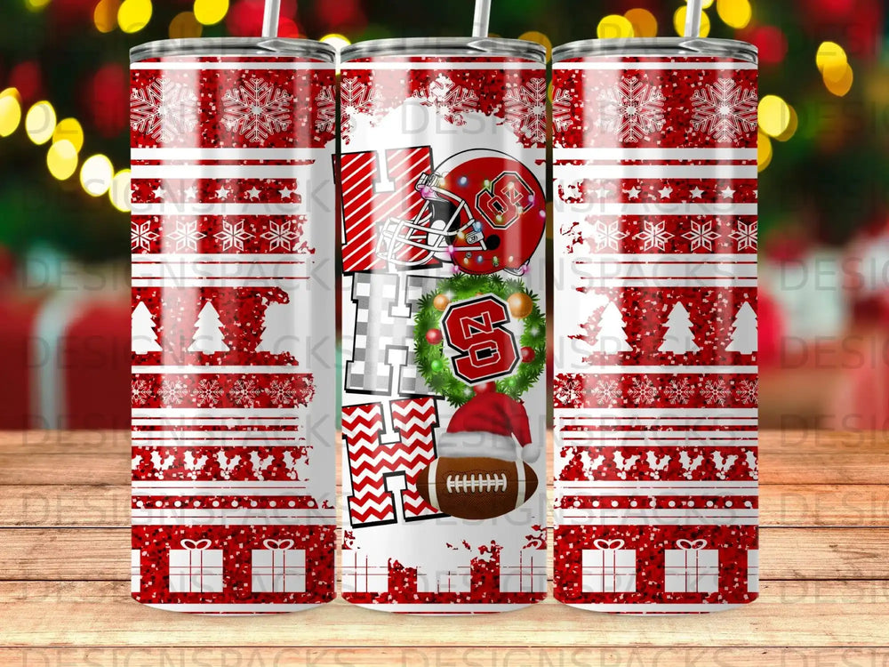 "HO HO HO" text with football and snowflakes on a red and white striped tumbler.