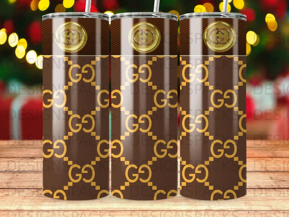 Brown tumbler with repeating gold GG pattern and Gucci logo detail.