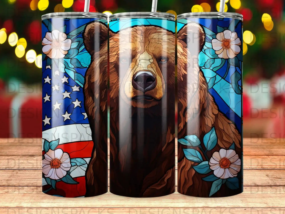 Bear face on American flag background with floral accents.