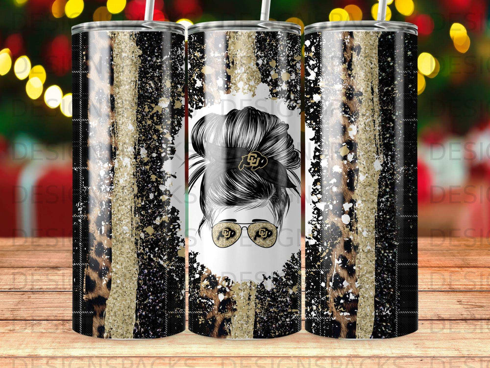 Woman's messy bun with Colorado Buffaloes logo on black, gold, and leopard print tumbler.