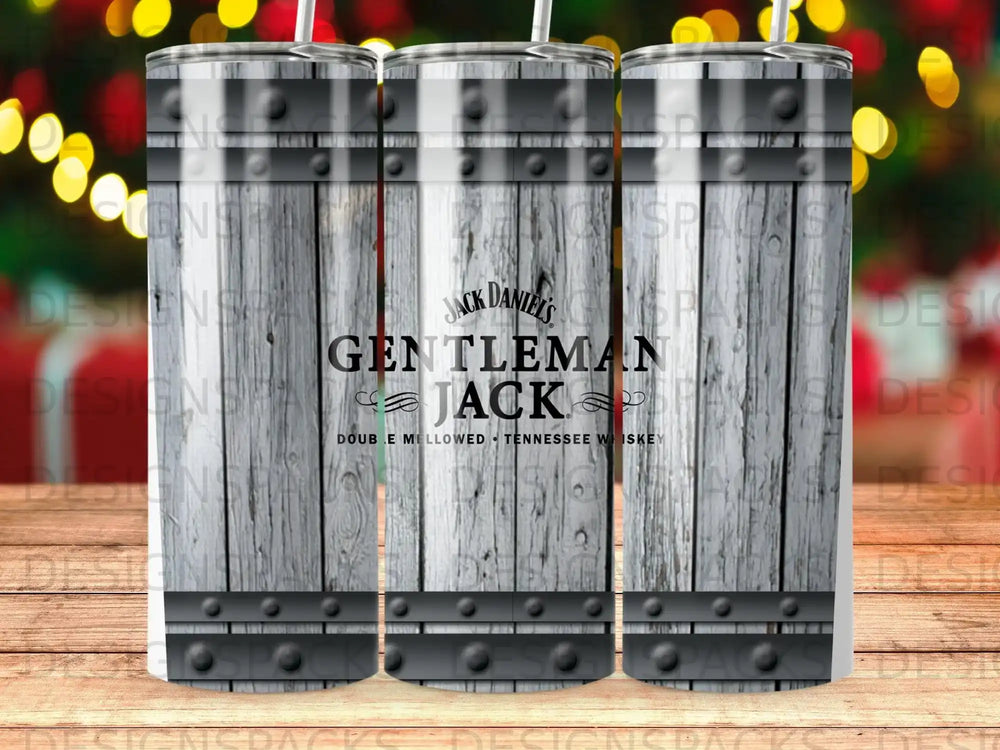 Jack Daniel's Gentleman Jack whiskey tumbler with barrels and bokeh lights.