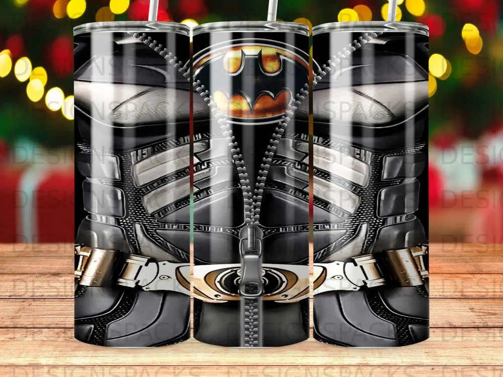 Batman armored suit design on three tumblers with blurred festive lights background.
