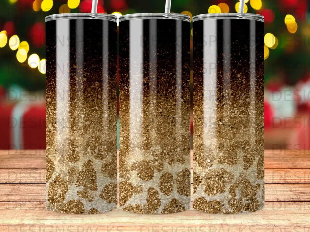 Three tumblers with a gradient of black, gold glitter, and animal print pattern.