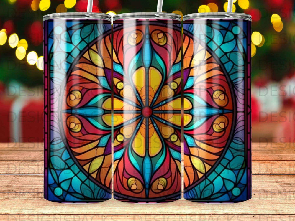 Colorful stained glass mandala tumbler design on a wooden background.