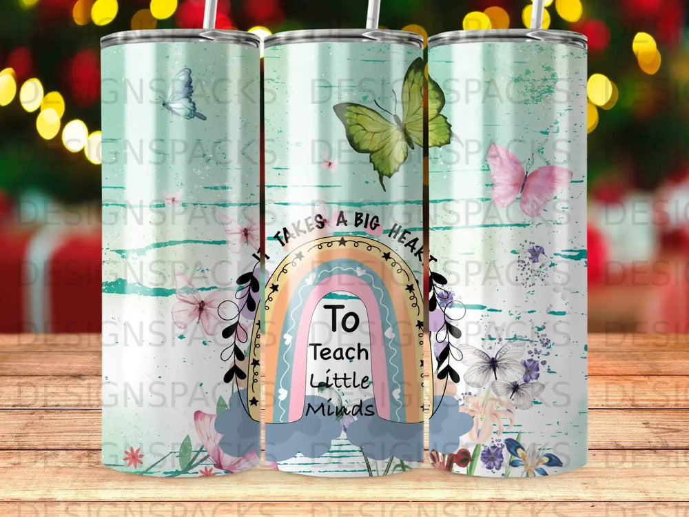 Tumbler with butterflies, rainbow, and "Takes a big heart to teach little minds" text.