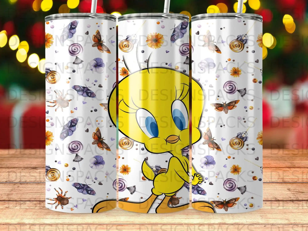 Tweety Bird character on a patterned tumbler with flowers and spiders.